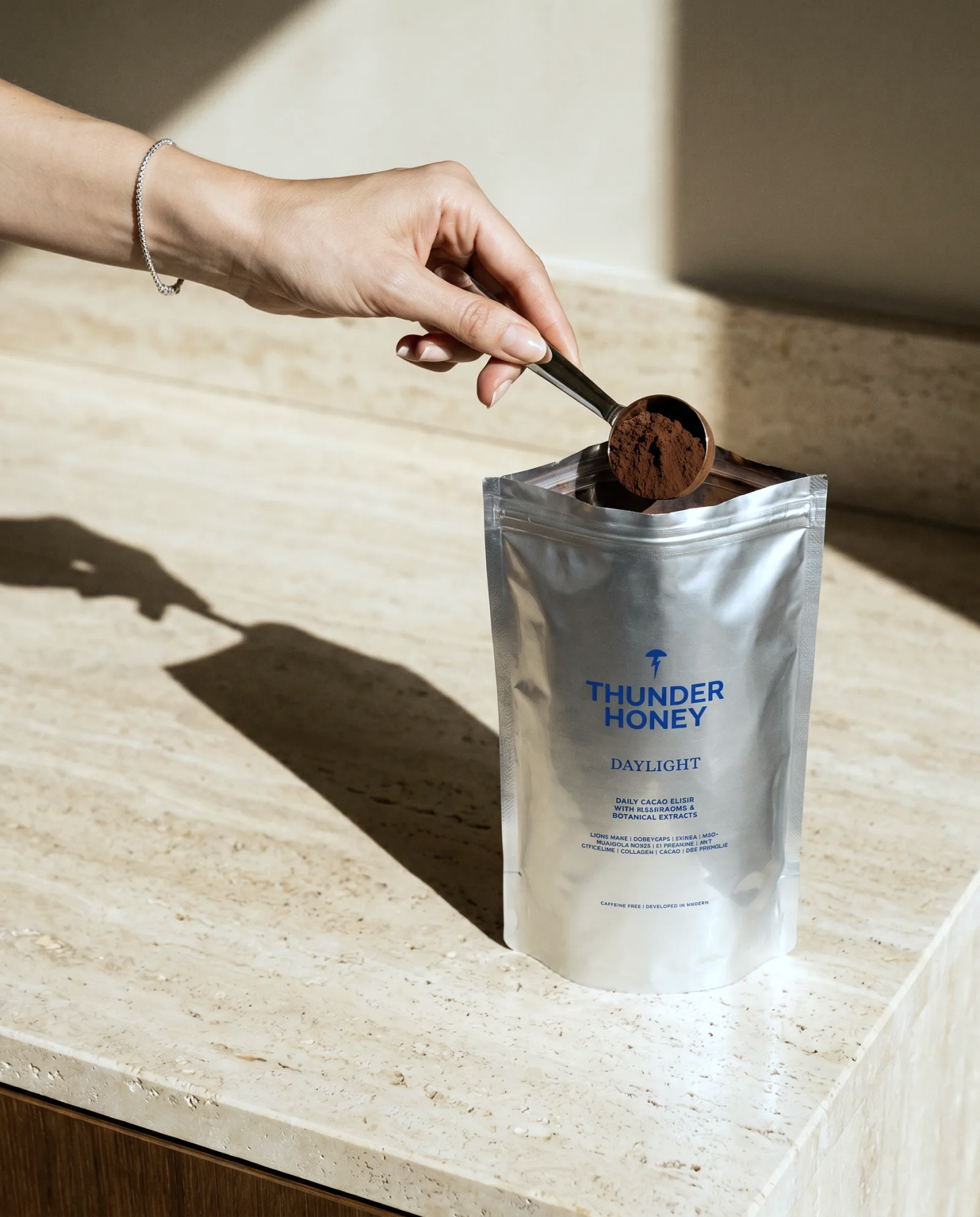 Scooping Thunder Honey cacao into a glass