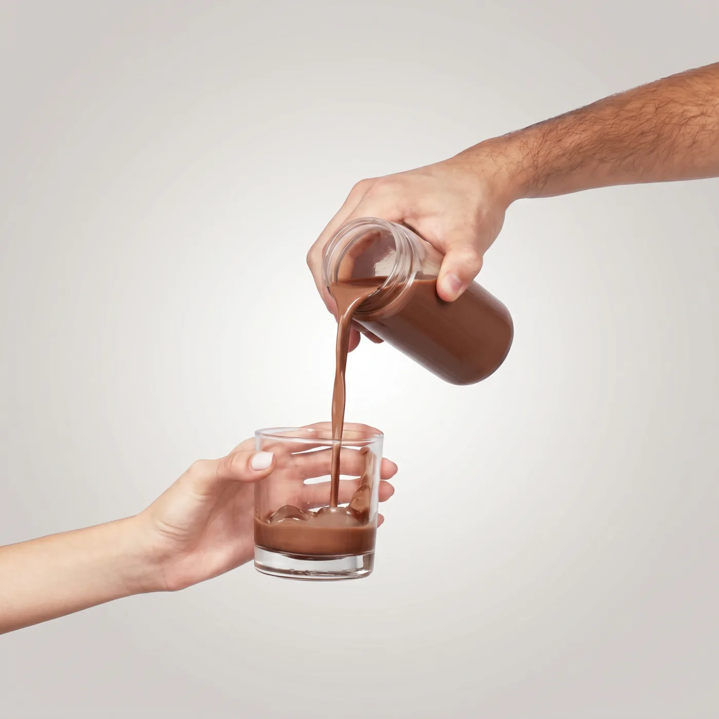 Pouring the warm cacao ritual into a glass