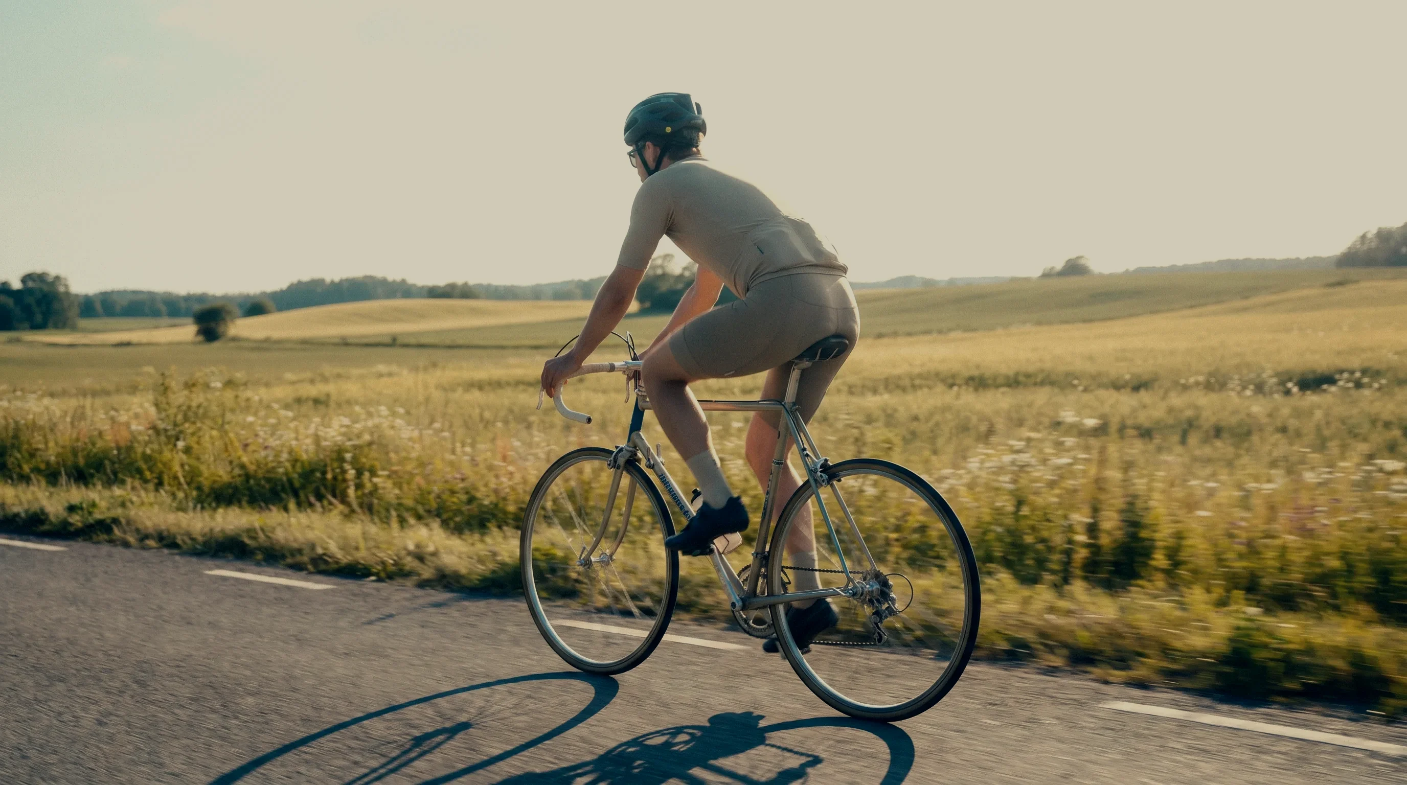 A cyclist on a quiet Nordic road