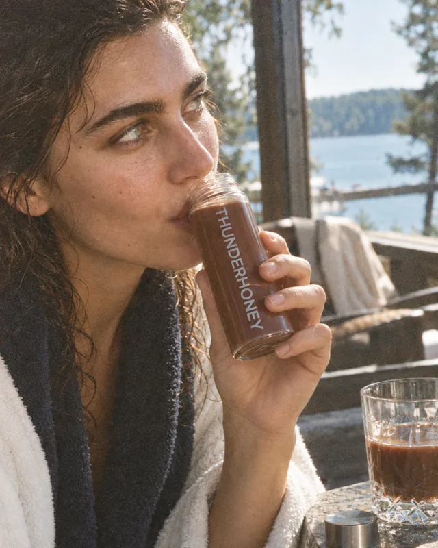 Drinking from the glass bottle on the terrace
