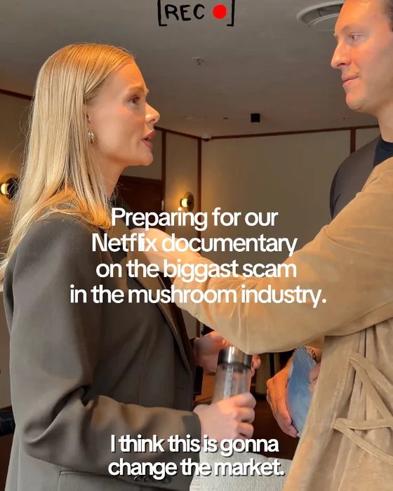 A woman and a man talking in a hallway, with the words Preparing for our Netflix documentary on the biggest scam in the mushroom industry