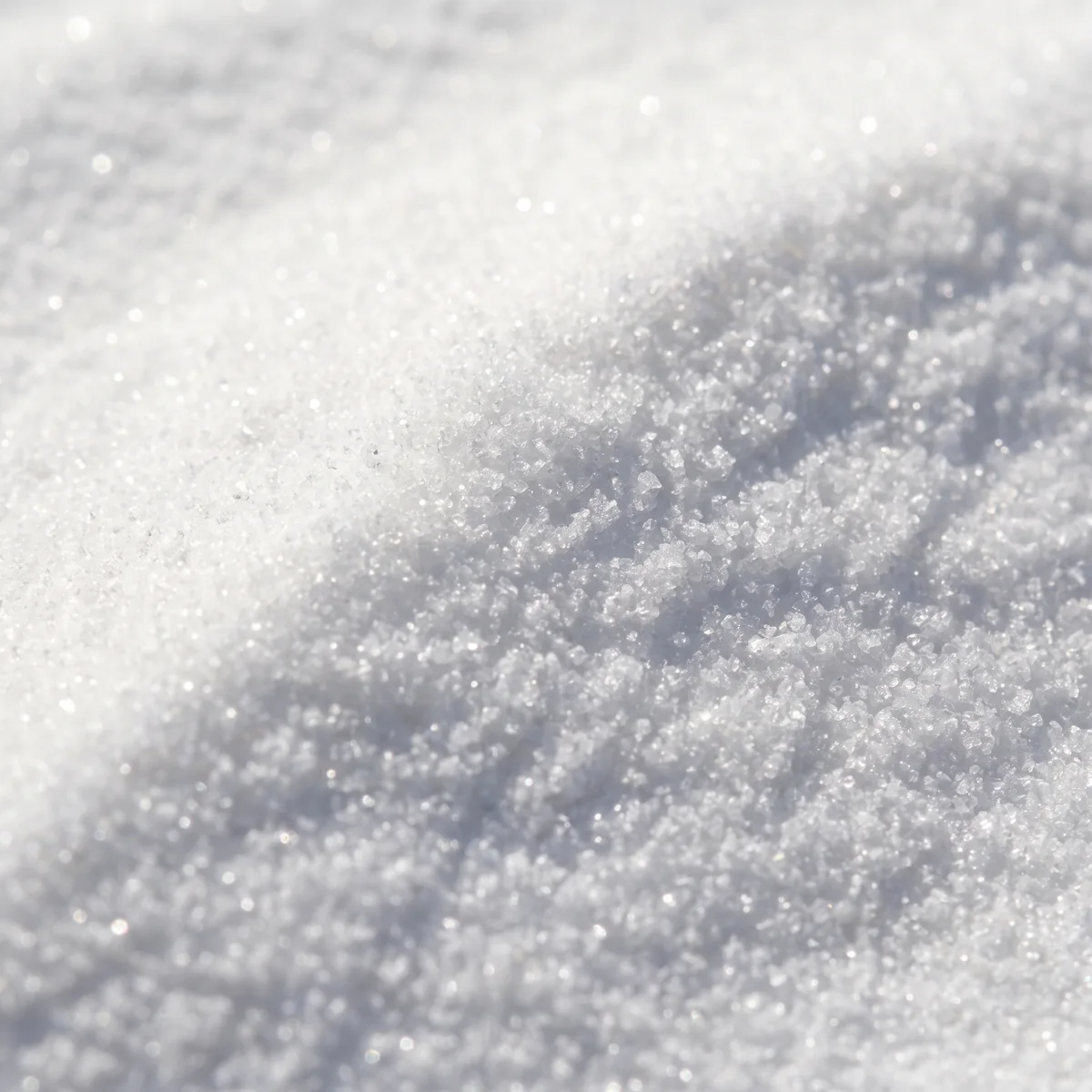 Nicotinamide riboside up close, a fine white crystalline powder catching the light