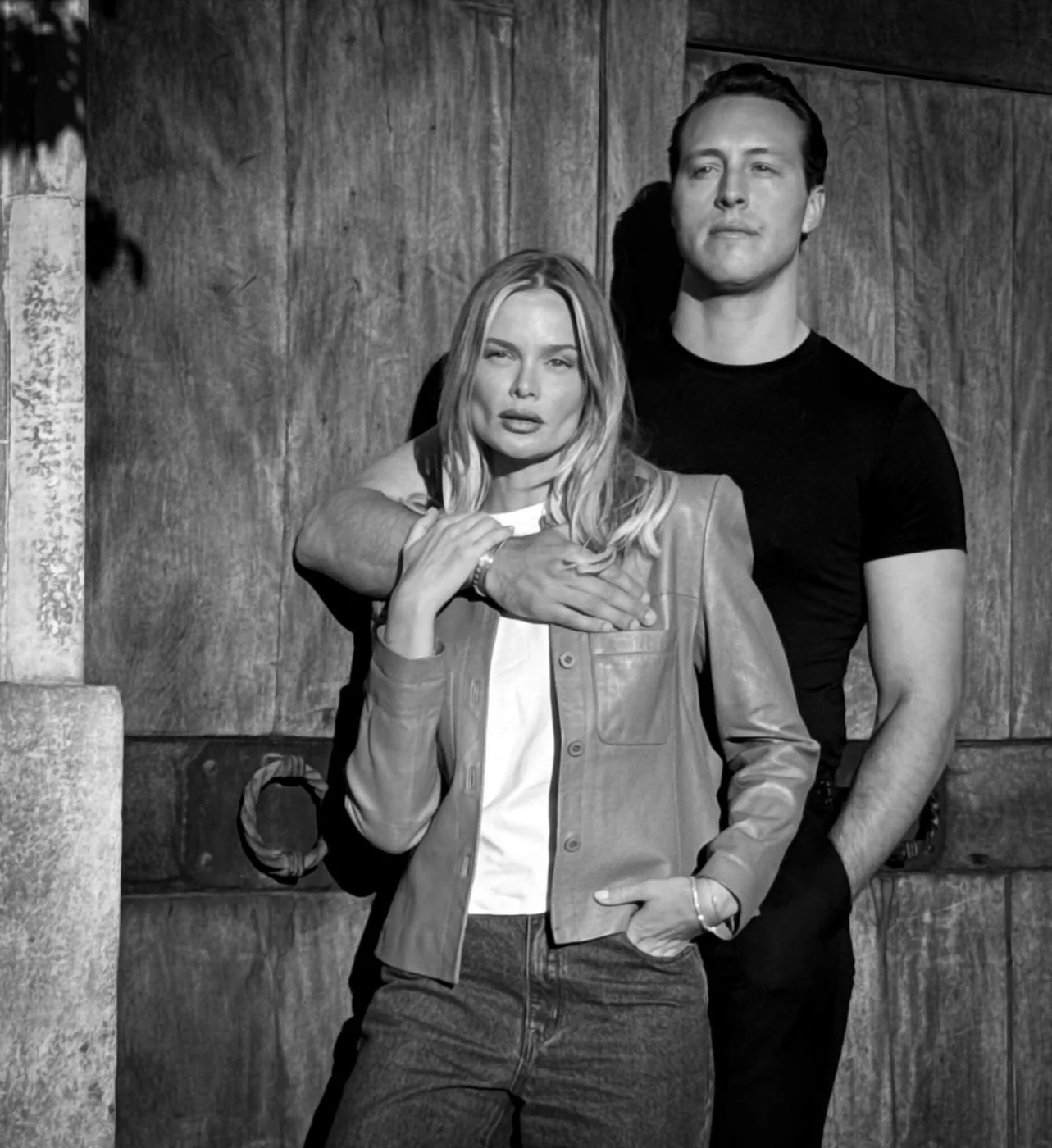 Joakim Bjarke and Nina Strauss, the founders of Thunder Honey, in a black and white portrait against an old wooden door