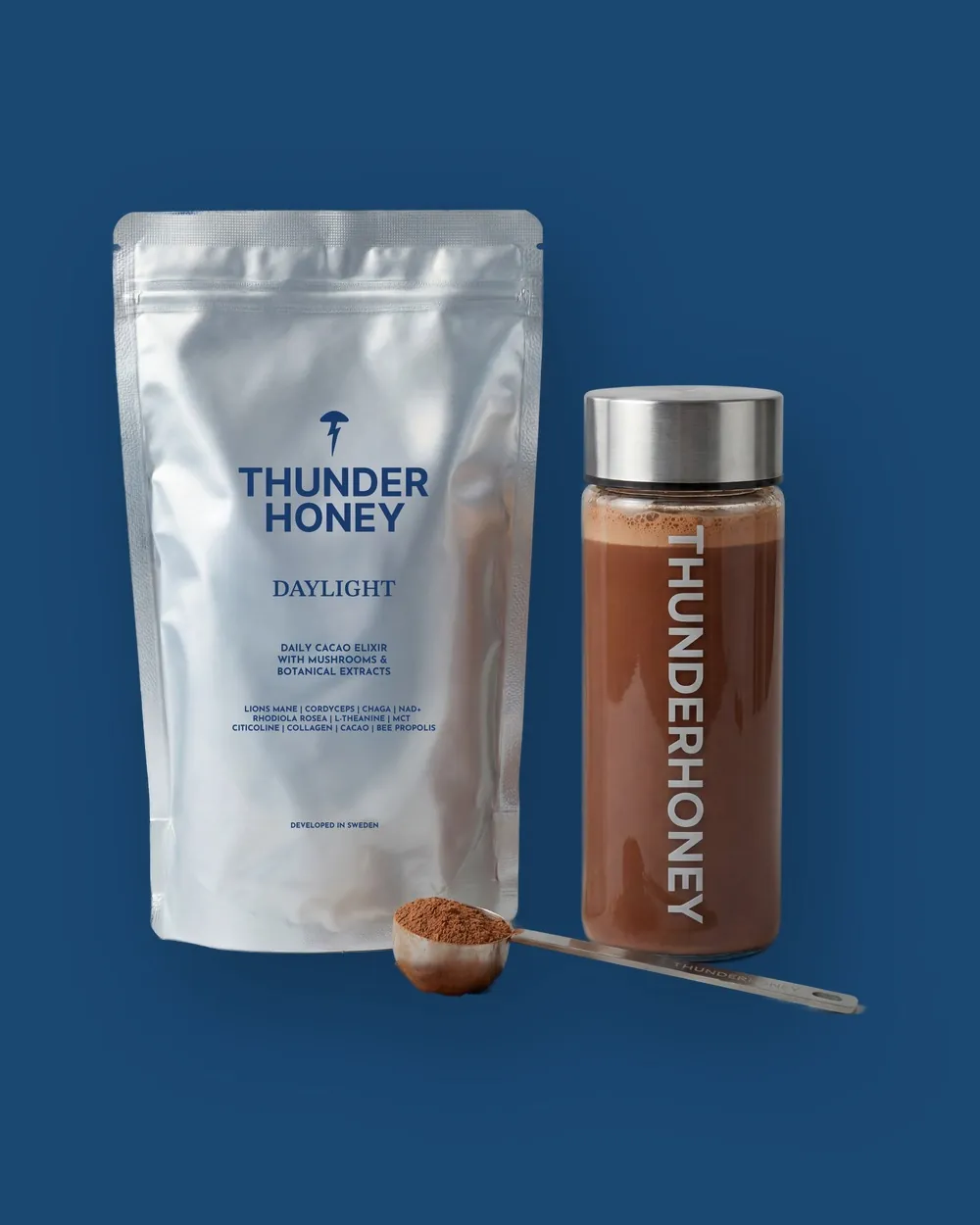 The Thunder Honey Daylight pouch beside its glass bottle and the steel measuring scoop