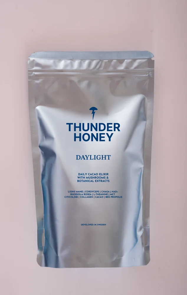 The Thunder Honey Daylight pouch, silver foil with the navy wordmark