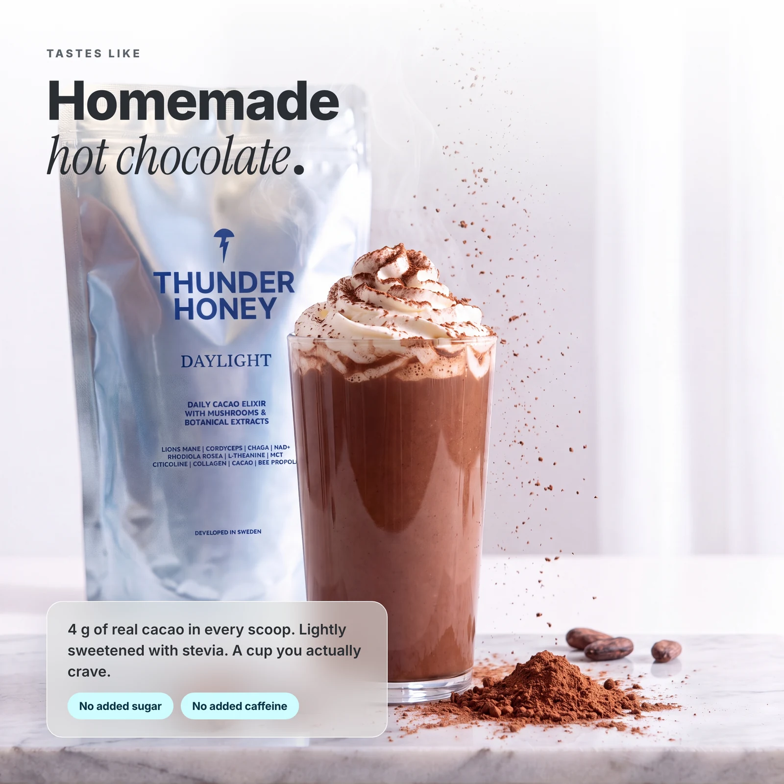 A glass of Thunder Honey cacao held up in hand